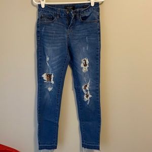 Distressed leopard patch jeggings